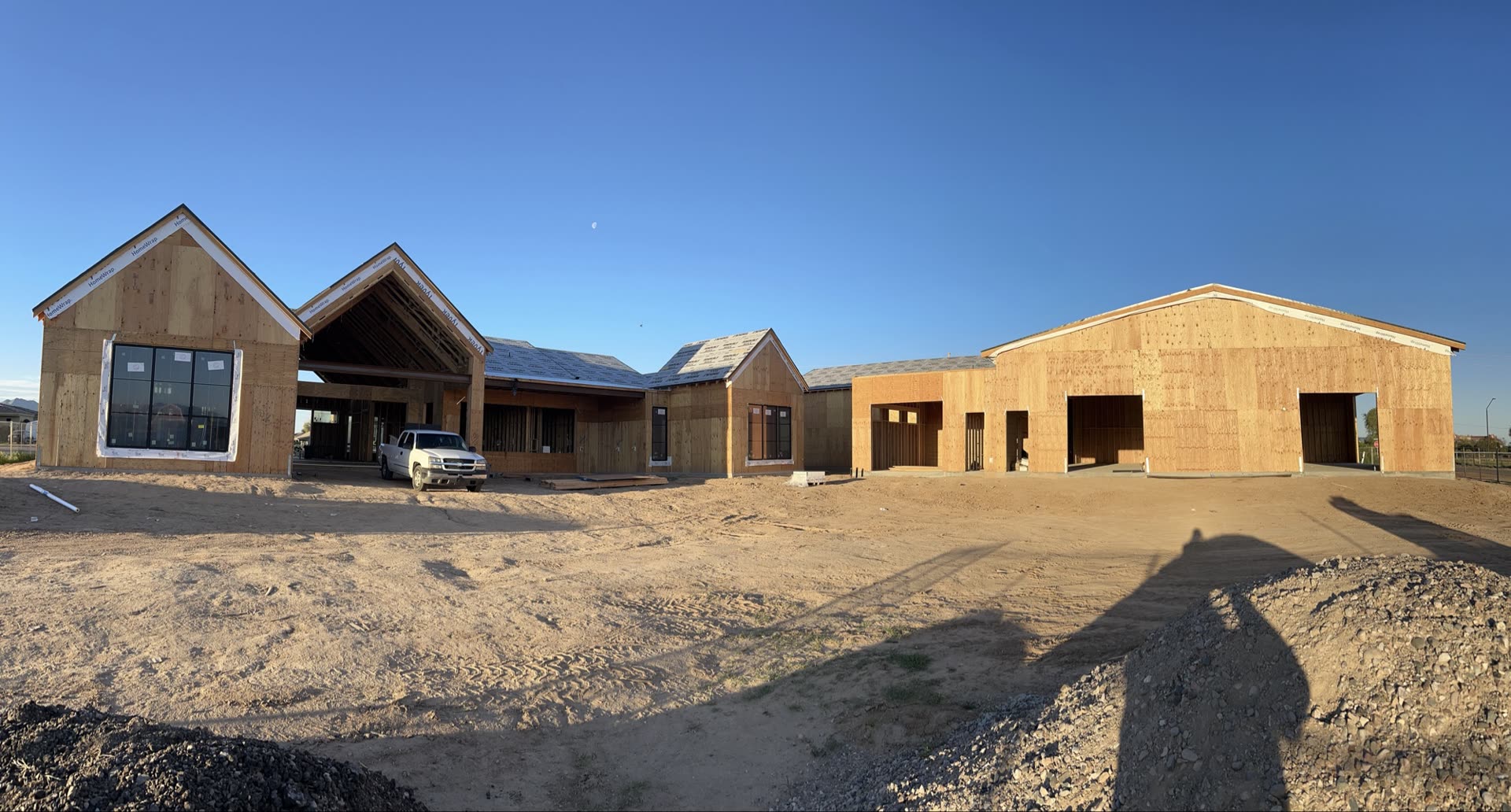 Wide panoramic view of a completed Ace Threw Z Homes custom home framing job in Phoenix Arizona
